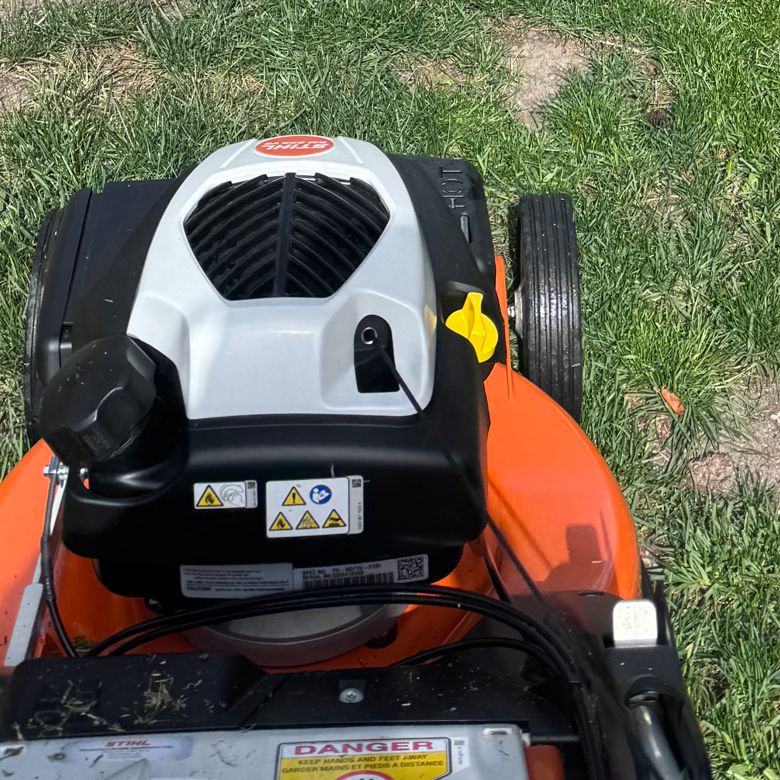 Closeup of a lawnmower at work